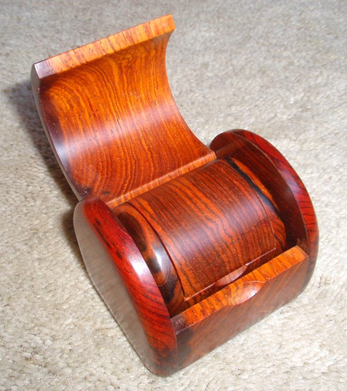 Four nested chest-shaped cocobolo wood boxes