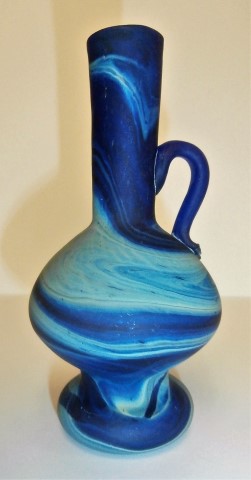 Elongated 1 handle vase with stand