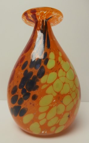 Orange vase with red , blue, and yellow