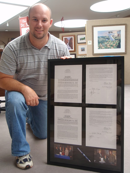 Jared
                                Burkhart bill-signing framing
