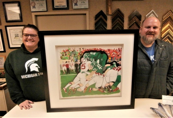Kate created
                        this multi-layered painting depicting the
                        critical final play of the Michigan State
                        University win in the 2014 Rose Bowl.