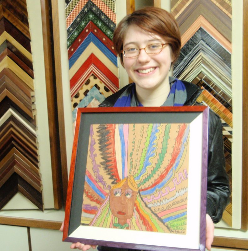 Meghan and her newly framed artwork
                              from youth