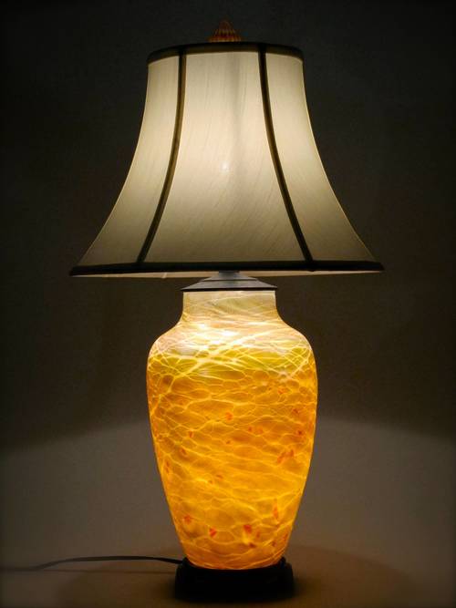 Large lustre
                    lamp in gold